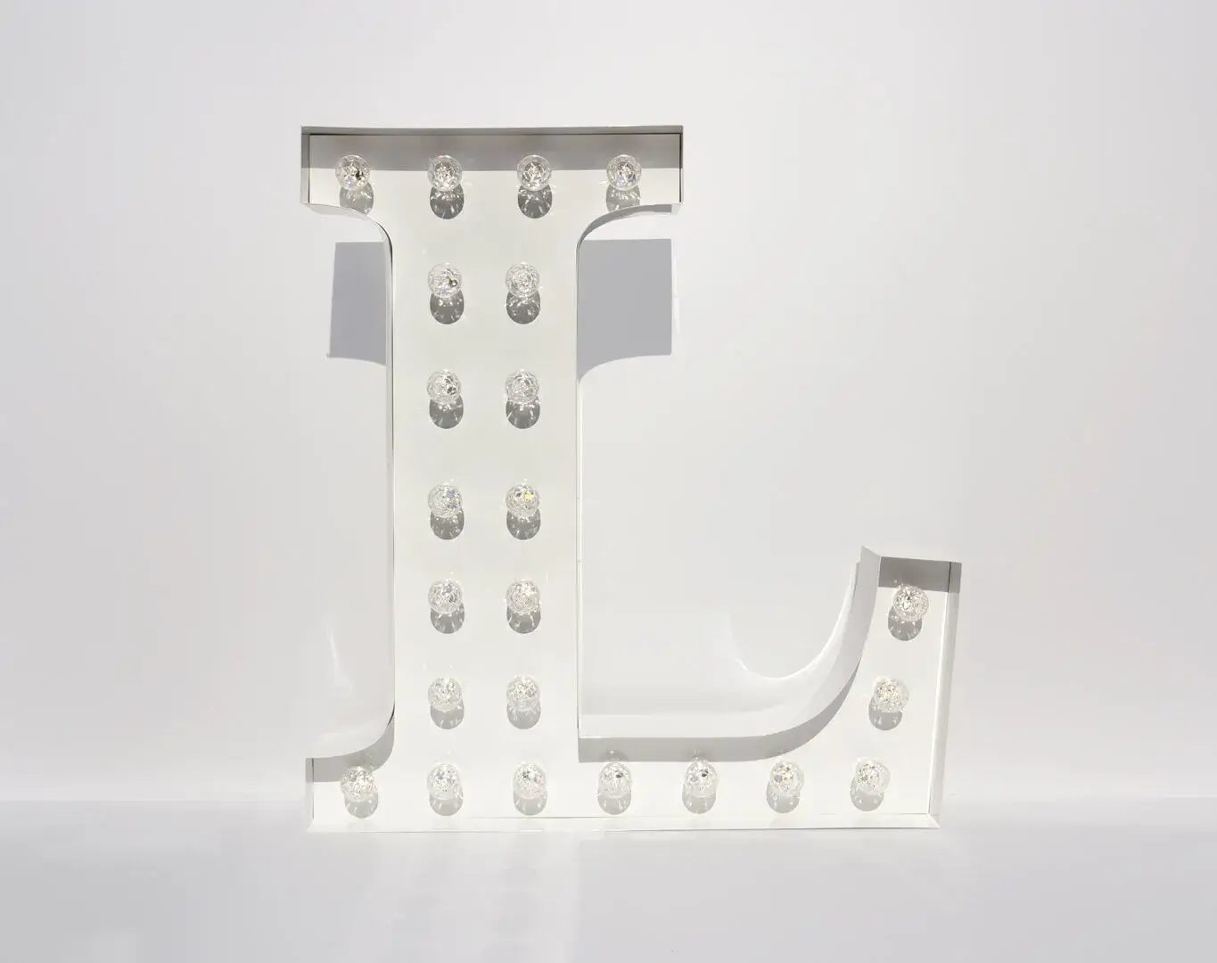 Standing letter with white light bulbs